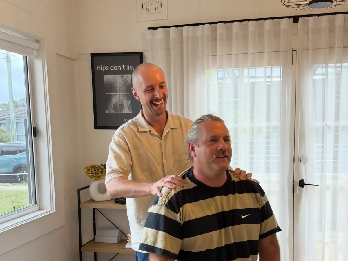 Dr Luke Stone with a patient in the adjusting room