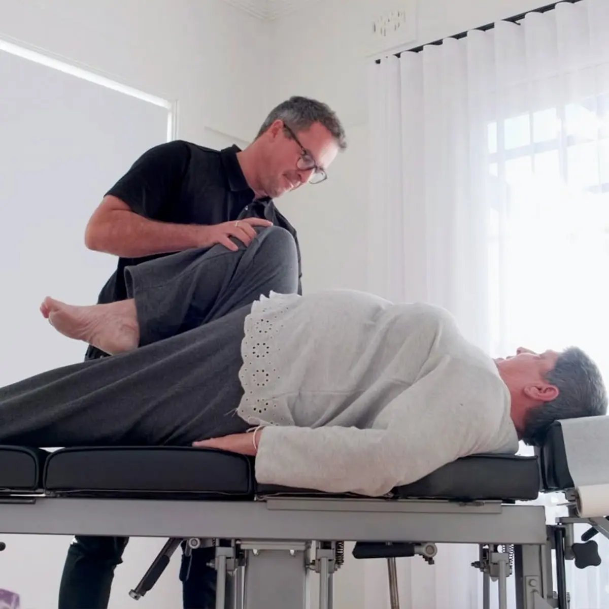 Dr Luke Stone performing a chiropractic adjustment at the Newcastle clinic